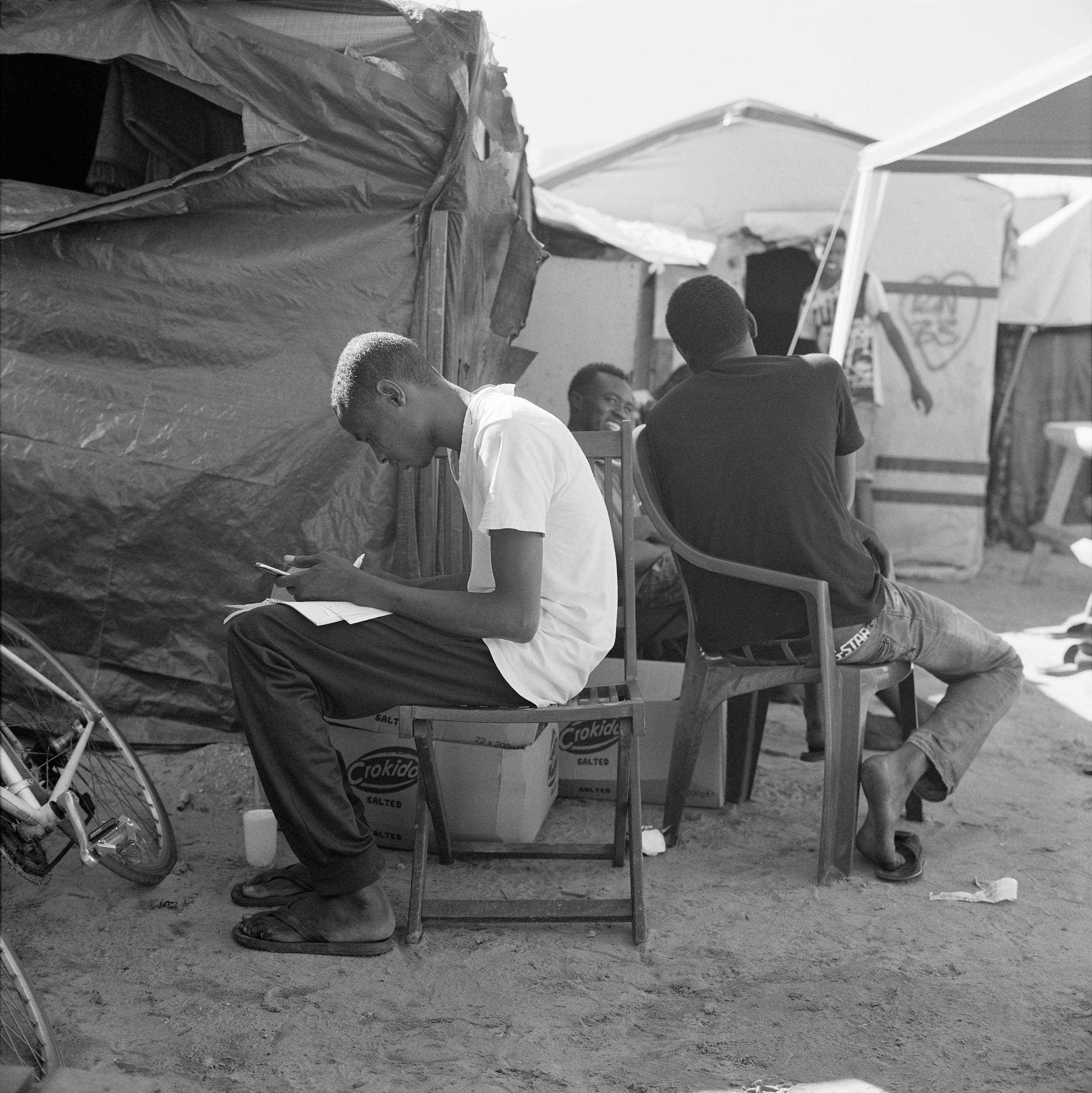 July 19, Mohamed studying French in the courtyard