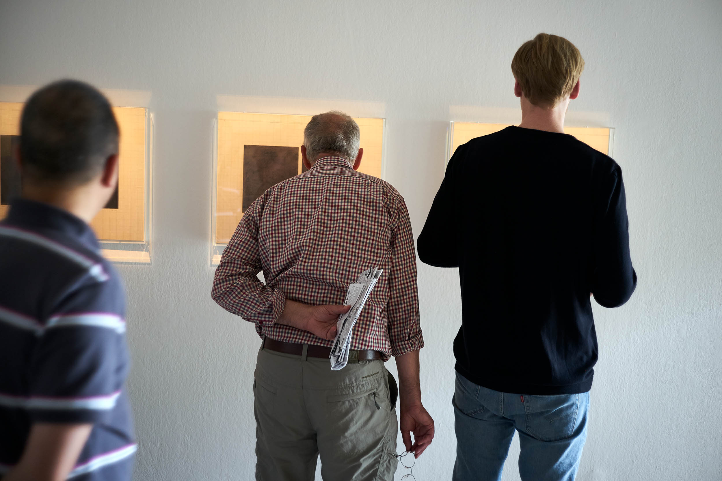 Visitors in front of Mirror Image 1, 2, 3 by Lala Rukh, Documenta Halle, Kassel, 2017