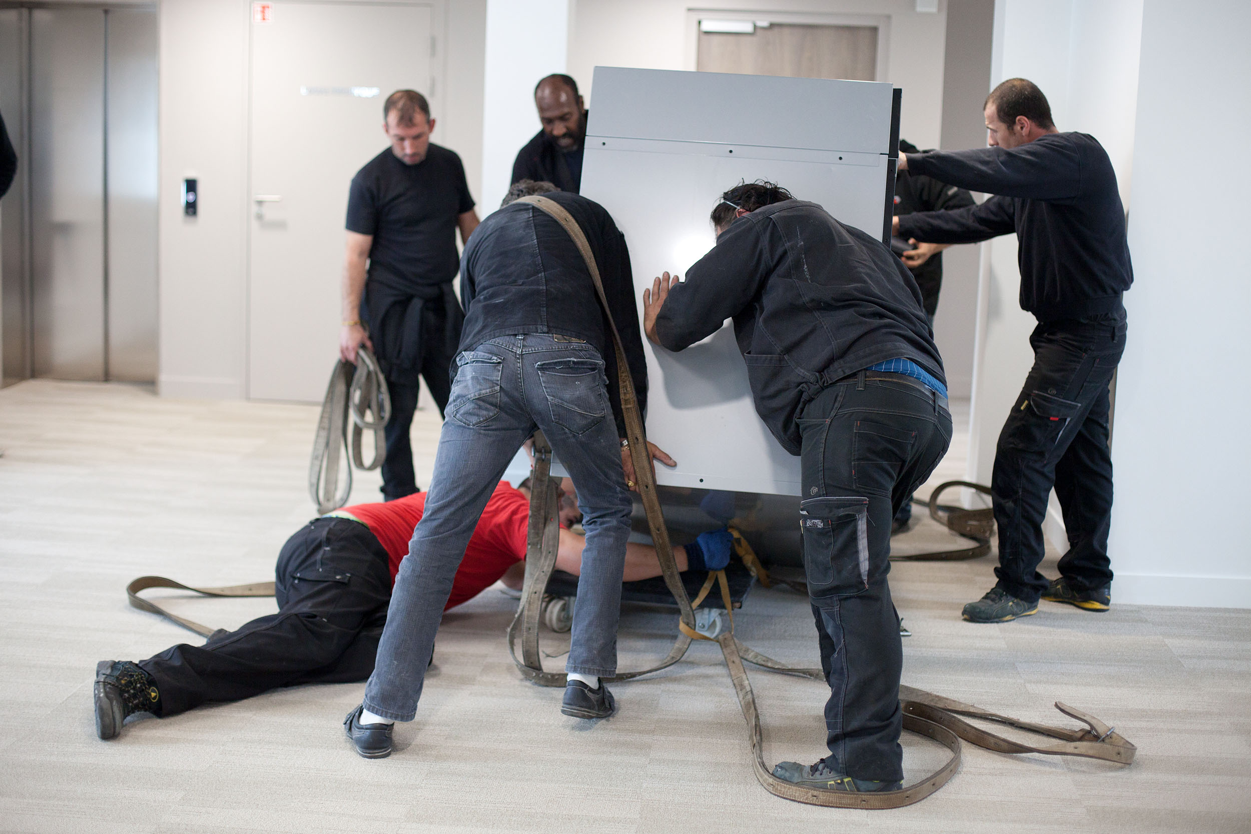 Delivery of a drinks vending machine via the staircase, new headquarters